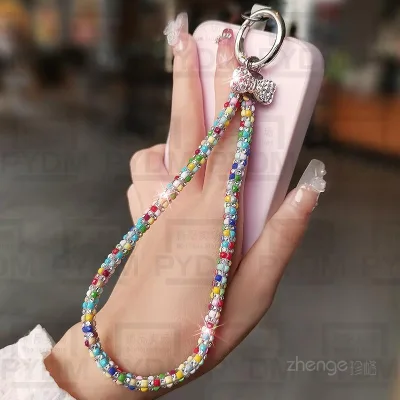 Phiên bản Hàn Quốc Dây chuyền điện thoại di động kim cương nhấp nháy ins Dây đeo điện thoại di động ngắn thời trang Dây đeo tay Dây đeo cổ tay Dây đeo cổ tay Nữ cao cấp Mặt dây chuyền điện thoại di động Vỏ điện thoại di động Dây đeo điện thoại di đ