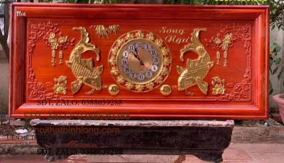 Tranh đồng hồ treo tường trạm khắc song ngư bằng gỗ hương đá kt 48×108×4cm .