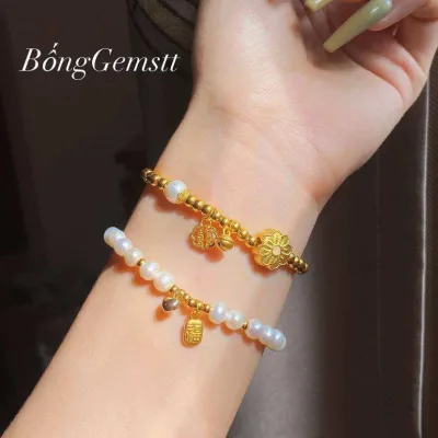 lắc tay nữ ngọc trai Phú Quốc mix charm bi vàng 24k vàng 9999, charm chú vàng 24k 9999, lõi khoá và charm tim vàng tây 18k, trang sức vòng tây, trang sức thiết kế đủ hoá đơn thẻ bảo hành