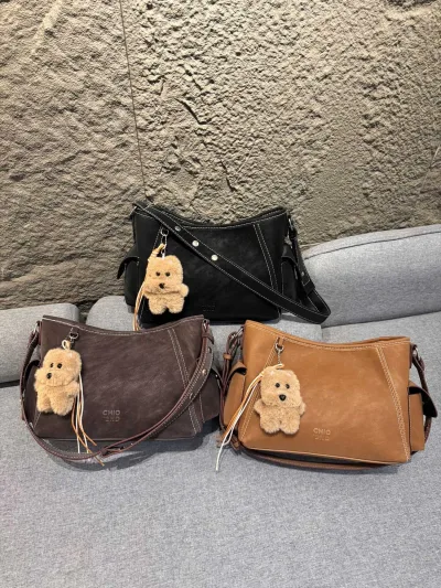 Women's Underarm Bag in Three Colors: Black, Brown, and Beige, with Stuffed Animal Accessories.